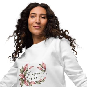 In My Own Season organic raglan sweatshirt in white with a rose and sage botanical wreath, front view