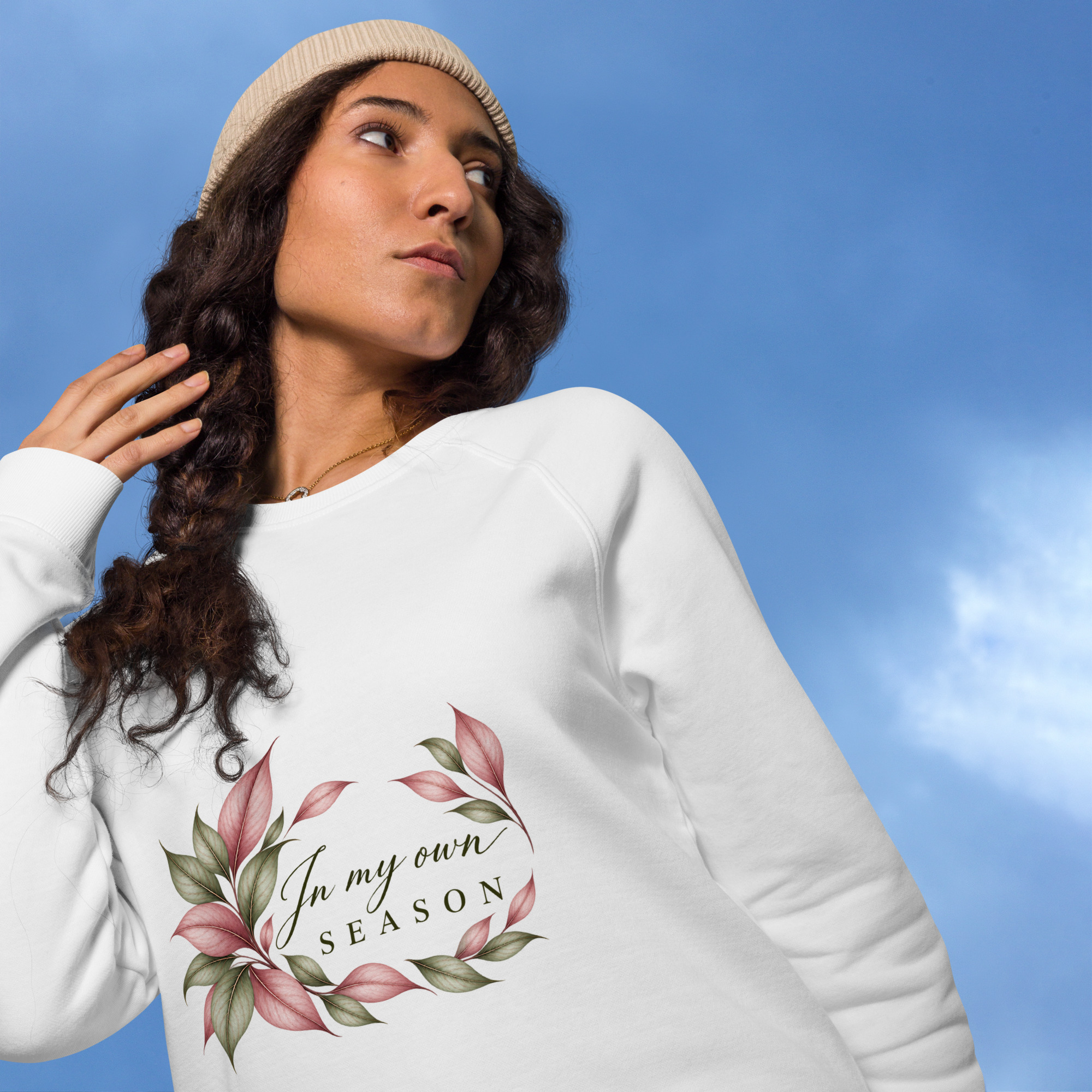 In My Own Season organic raglan sweatshirt in white with a rose and sage botanical wreath, front view