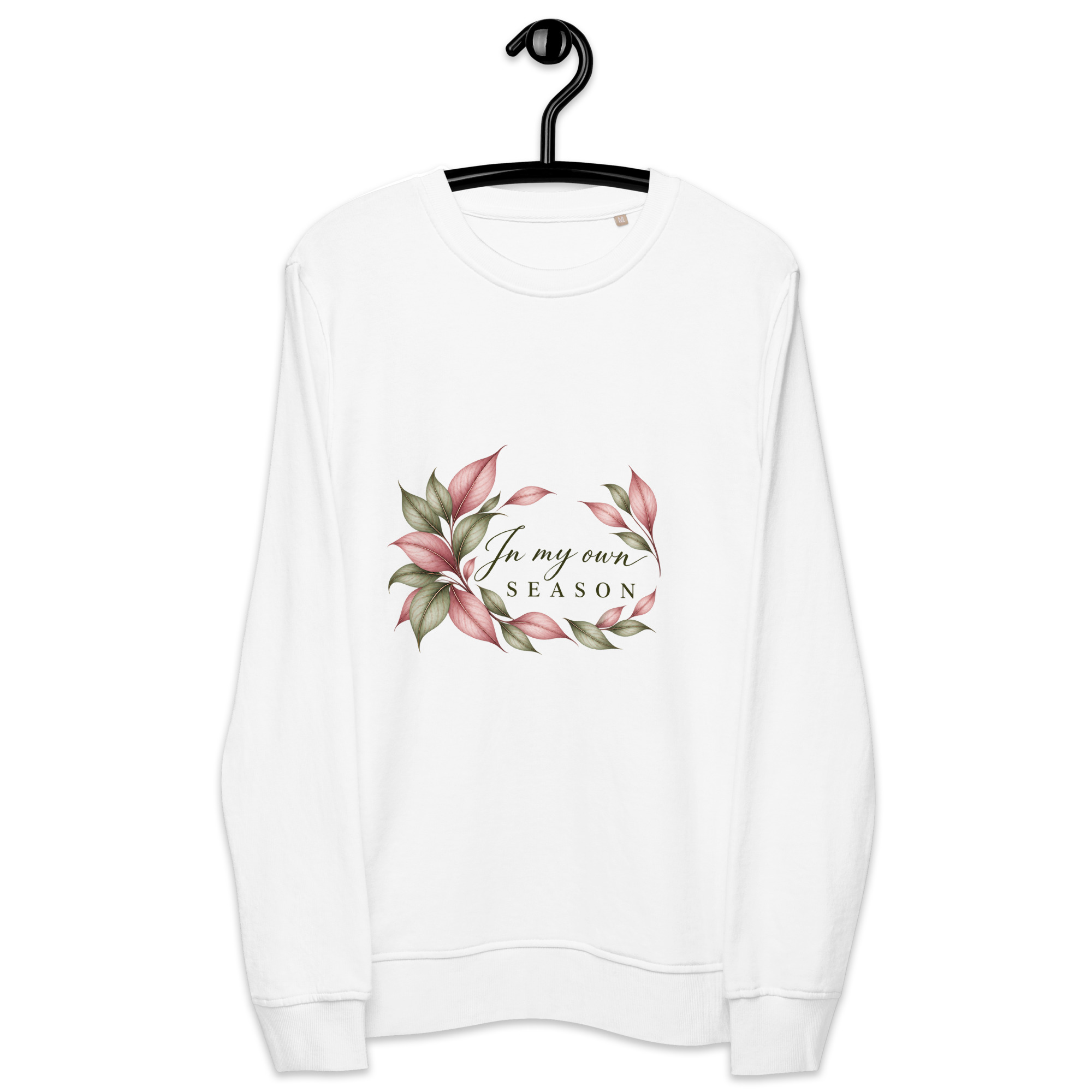 In My Own Season organic crewneck sweatshirt in white with a rose and sage botanical wreath, front view