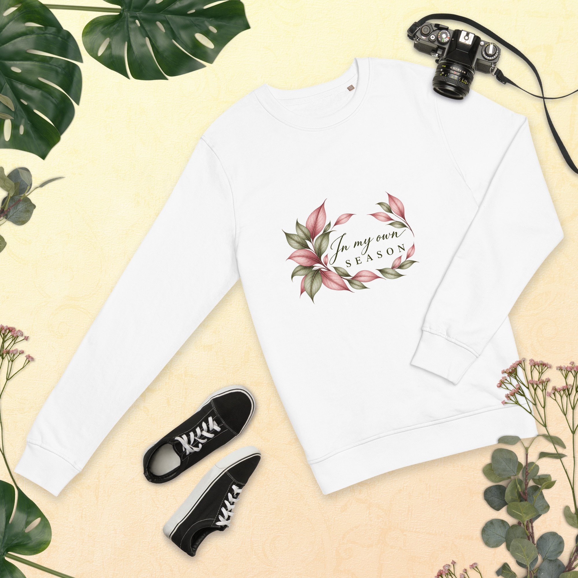In My Own Season organic crewneck sweatshirt in white with a rose and sage botanical wreath, front view